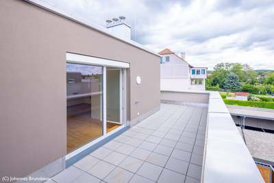 Dachgeschosswohnung mit Weitblick · Top 21